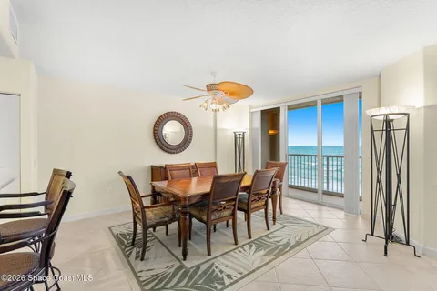 a kitchen with stainless steel appliances kitchen island granite countertop a table and chairs