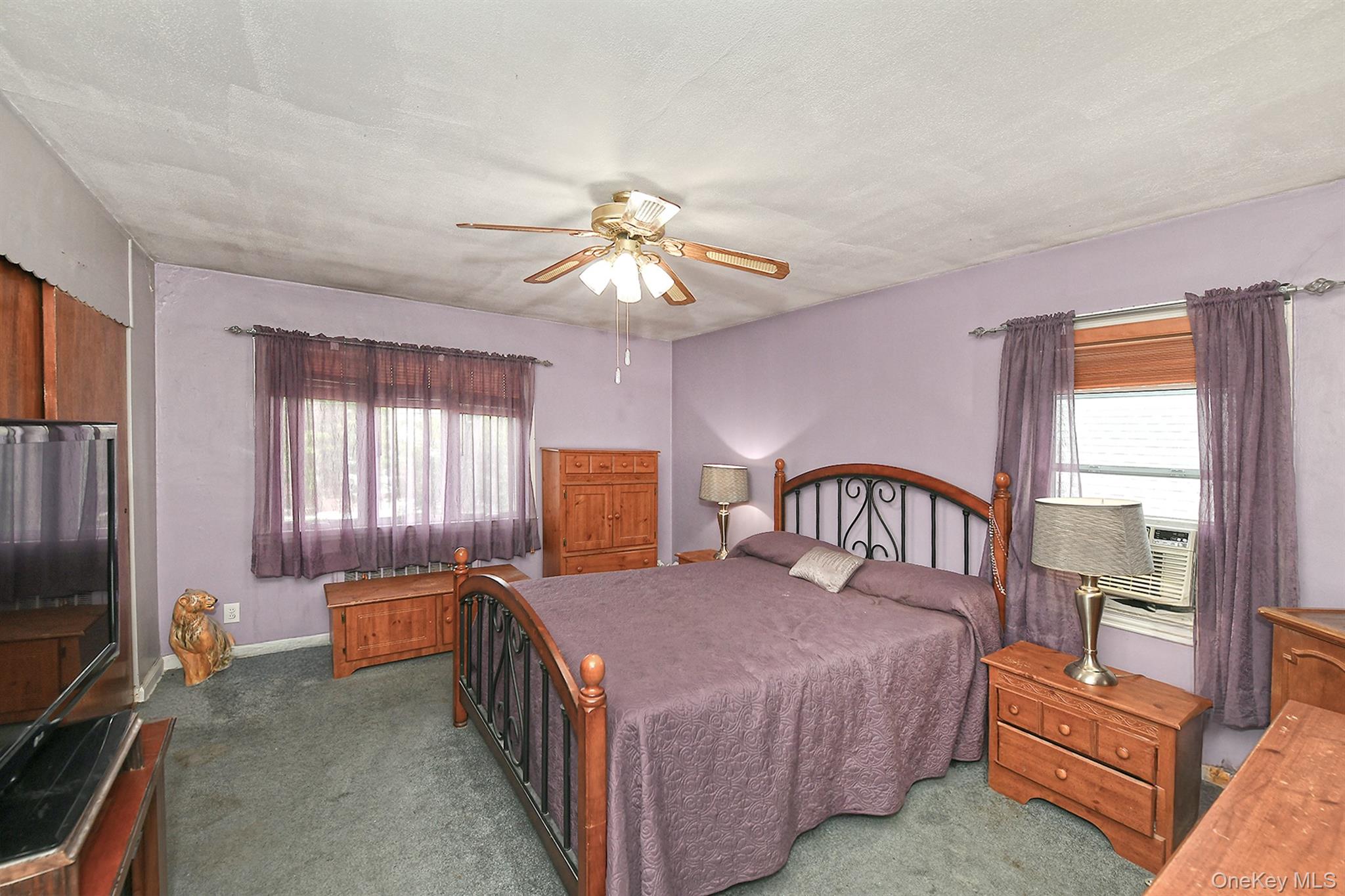 63-05 138th Street Queens, NY 11367 - Photo 11 of 22 Carpeted bedroom featuring ceiling fan and baseboards