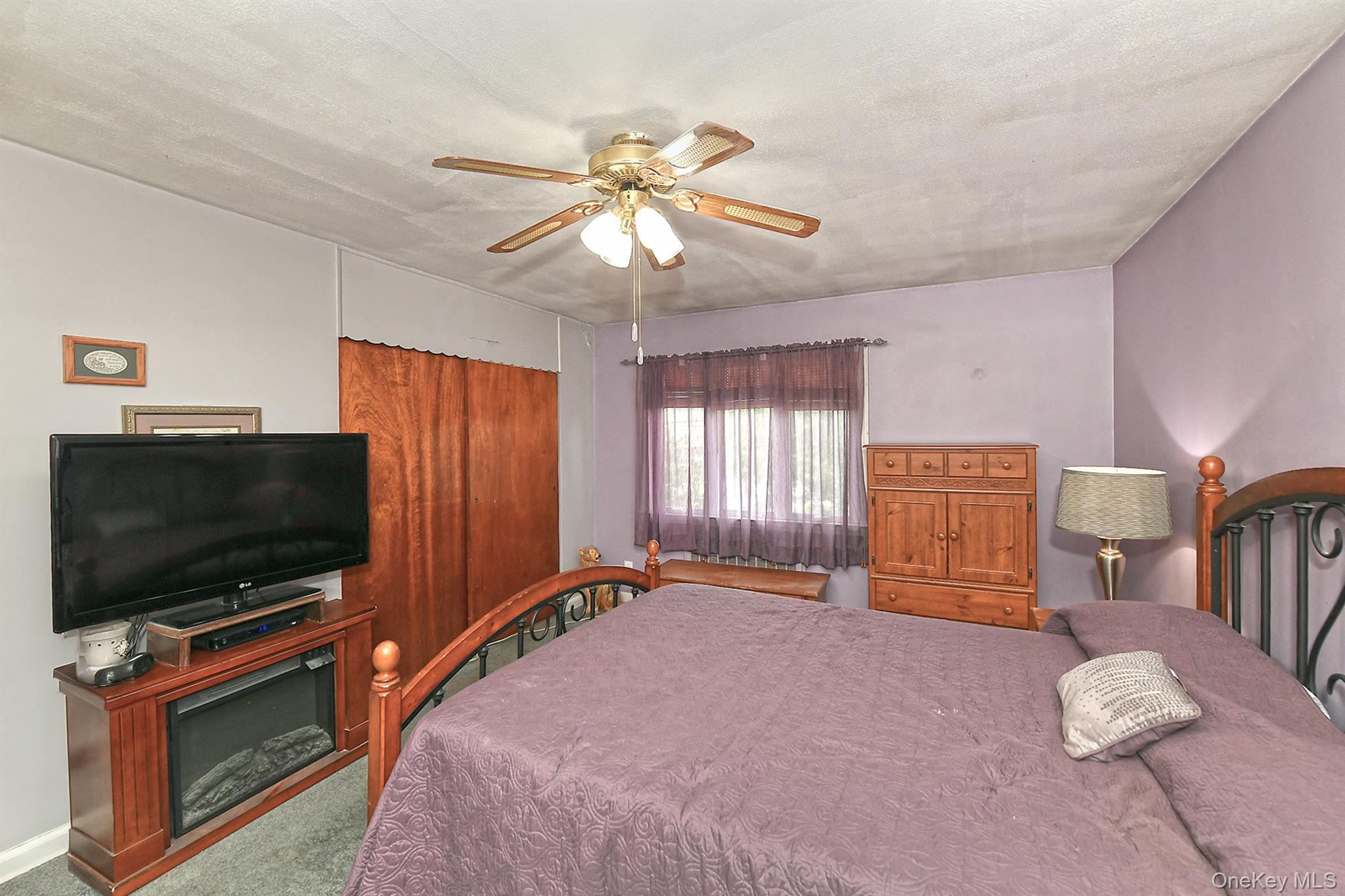 63-05 138th Street Queens, NY 11367 - Photo 12 of 22 Bedroom featuring carpet floors and ceiling fan