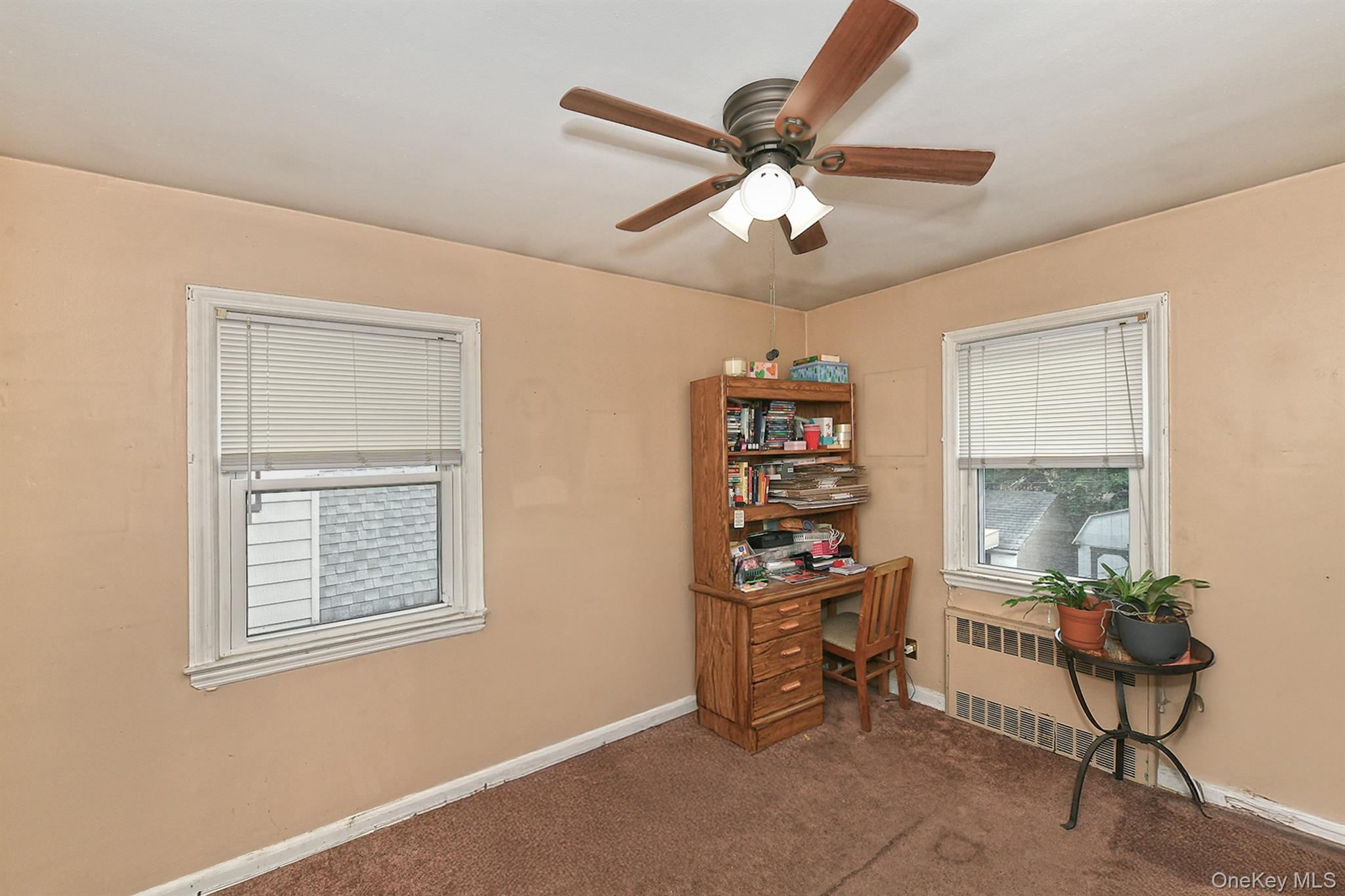 63-05 138th Street Queens, NY 11367 - Photo 14 of 22 Office space with a ceiling fan, radiator, and carpet floors