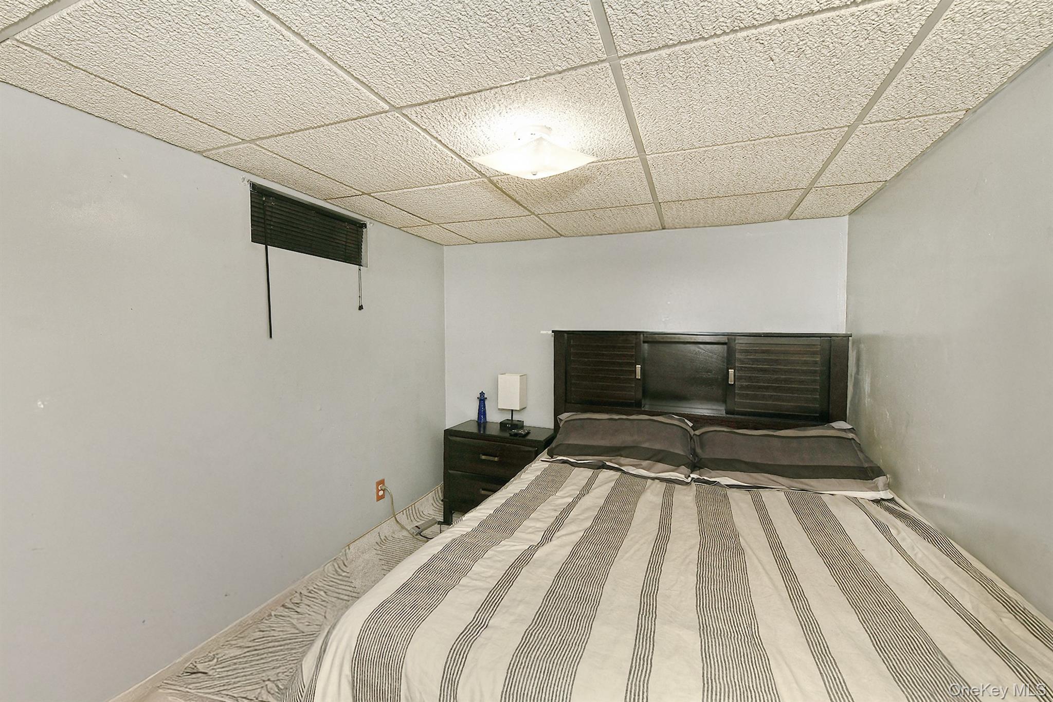 63-05 138th Street Queens, NY 11367 - Photo 16 of 22 Bedroom with a paneled ceiling