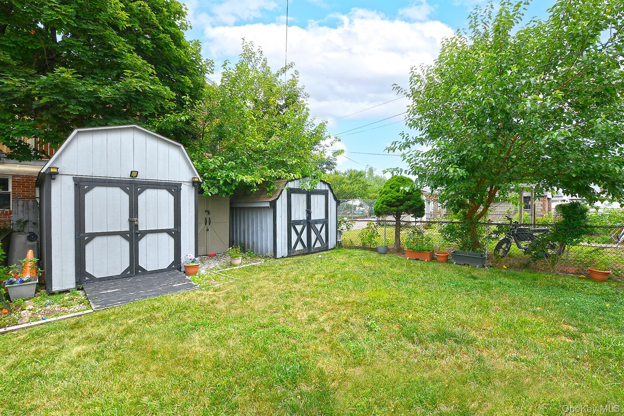 63-05 138th Street Queens, NY 11367 - Photo 20 of 22 View of yard with a shed