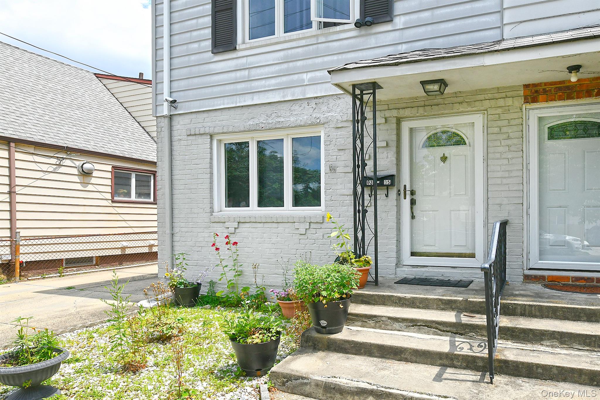 63-05 138th Street Queens, NY 11367 - Photo 3 of 22 Entrance to property with brick siding