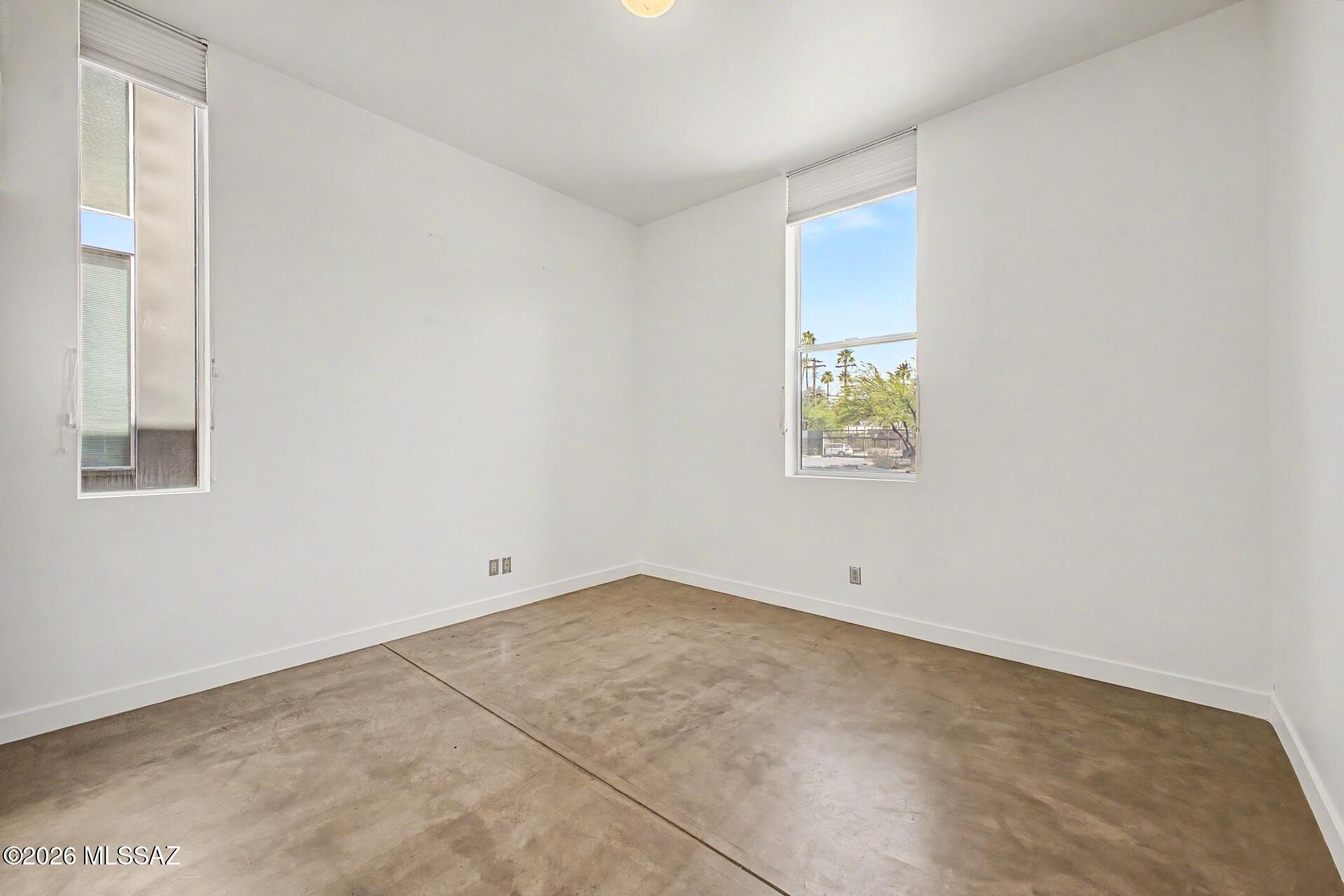 3605 East 3rd Street Tucson, AZ 85716 - Photo 15 of 39 The first floor features a bedroom with private access to a full bathroom.