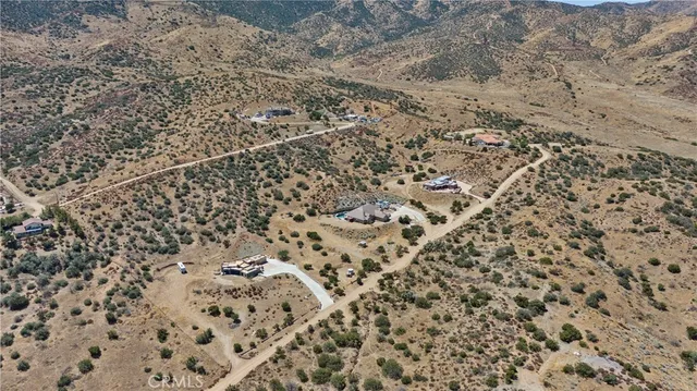 an aerial view of residential house with parking space