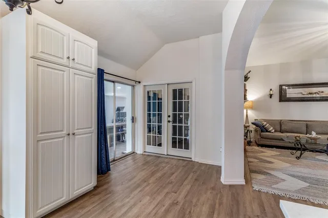 a view of a livingroom with furniture and an entryway
