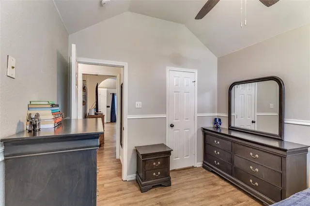 a living room with furniture and mirror