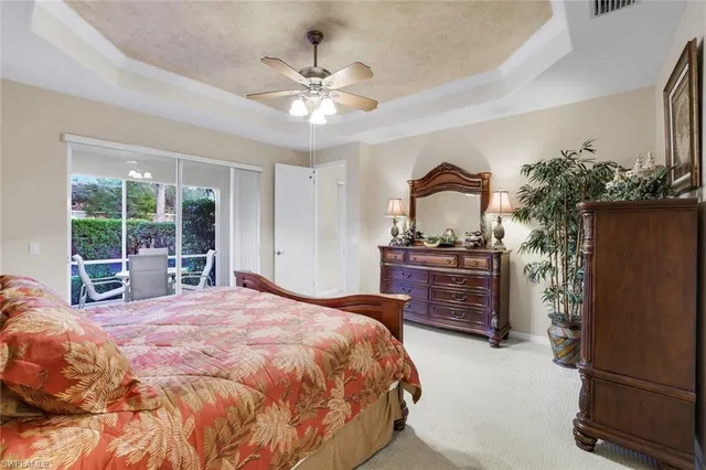 a spacious bedroom with a bed and a dresser