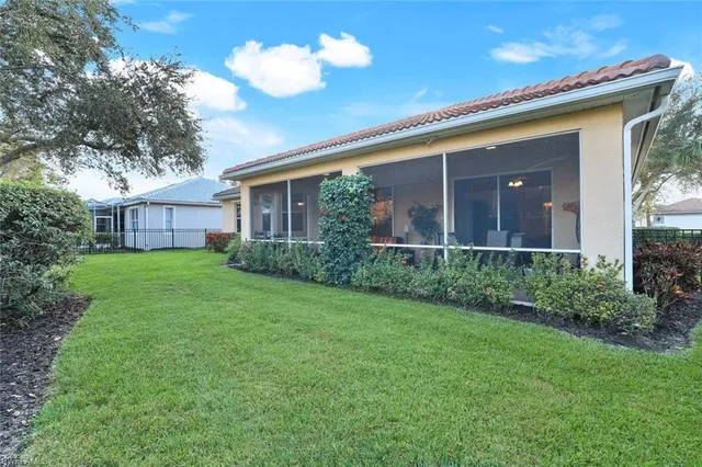 a view of a house with a back yard