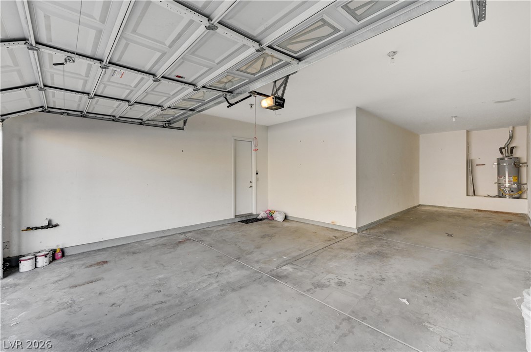 6761 Clay TABLET Street Las Vegas, NV 89149 - Photo 70 of 73 Concrete flooring and high ceilings define this highly functional multi-vehicle garage space.