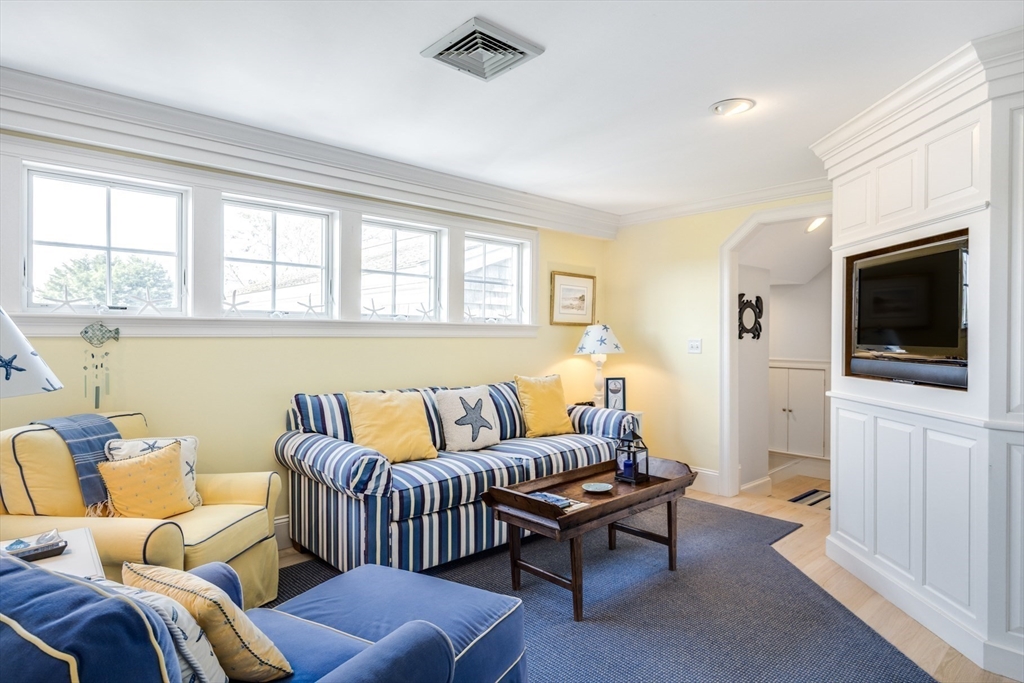 88 Champlain Road Chatham, MA 02633 - Photo 35 of 41 a living room with furniture and a flat screen tv