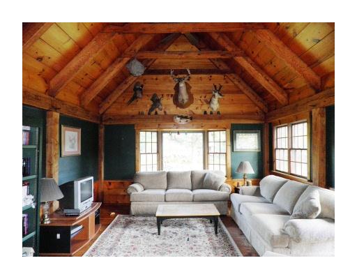5530 Flat River Road Coventry, RI 02827 - Photo 4 of 18 Den/Family/Great Room. The Great Room is the focal point of the home and is absolutely stunning. View shows the tall ceilings, timber framing with it s tongue and groove construction and solid 12" architectural beams. Wide pine plank flooring completes the look.
