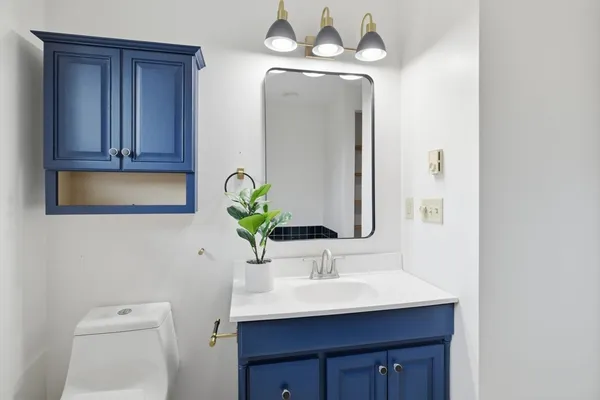 a bedroom with a bed and wall painting