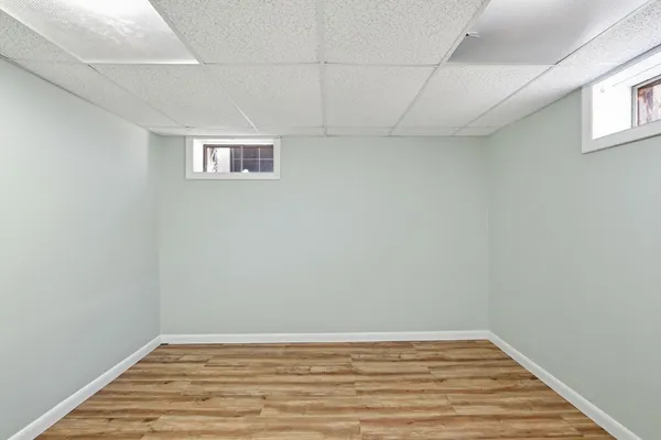 a view of a room with wooden floor and closet