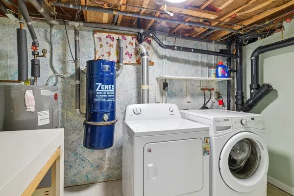 a view of a house with a porch and a yard