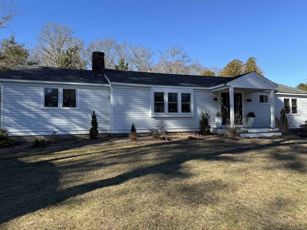 173 Guildford Road Barnstable, MA 02632 - Photo 2 of 26 a front view of a house with a yard