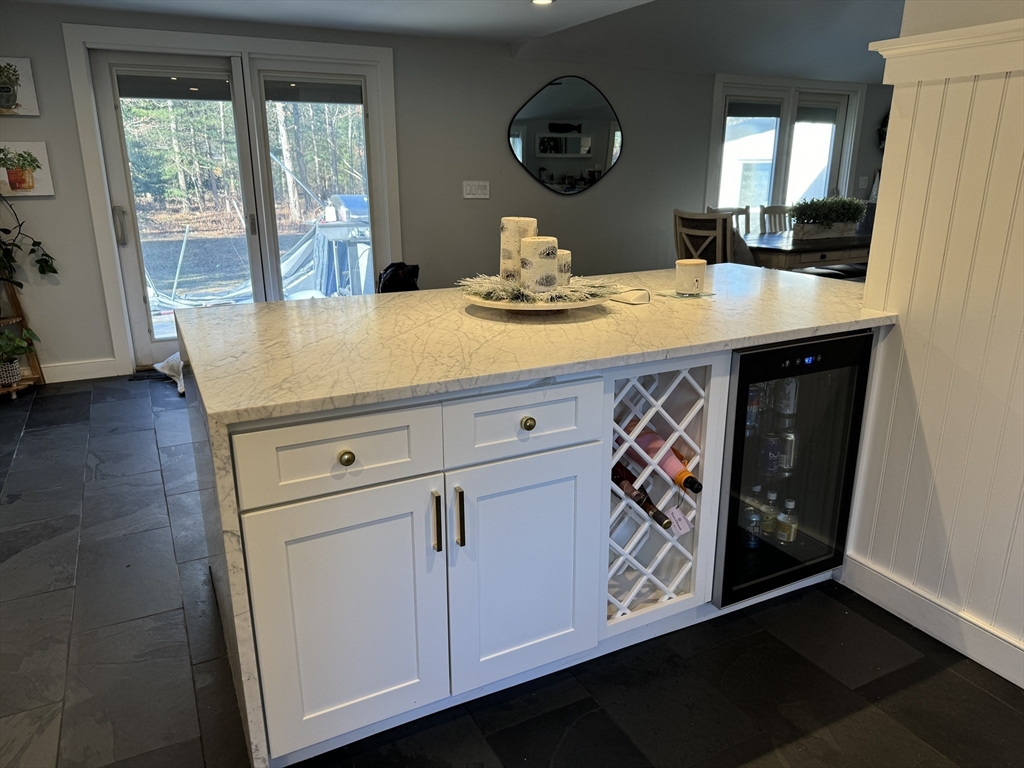 173 Guildford Road Barnstable, MA 02632 - Photo 5 of 26 a kitchen with a sink a stove and cabinets