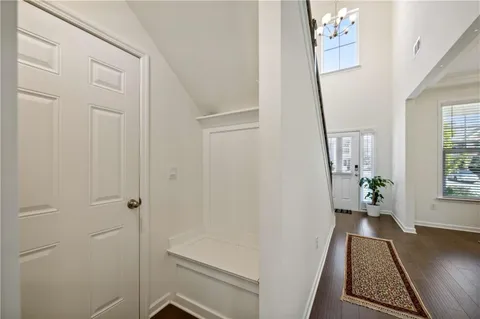 a view of an entryway with wooden floor