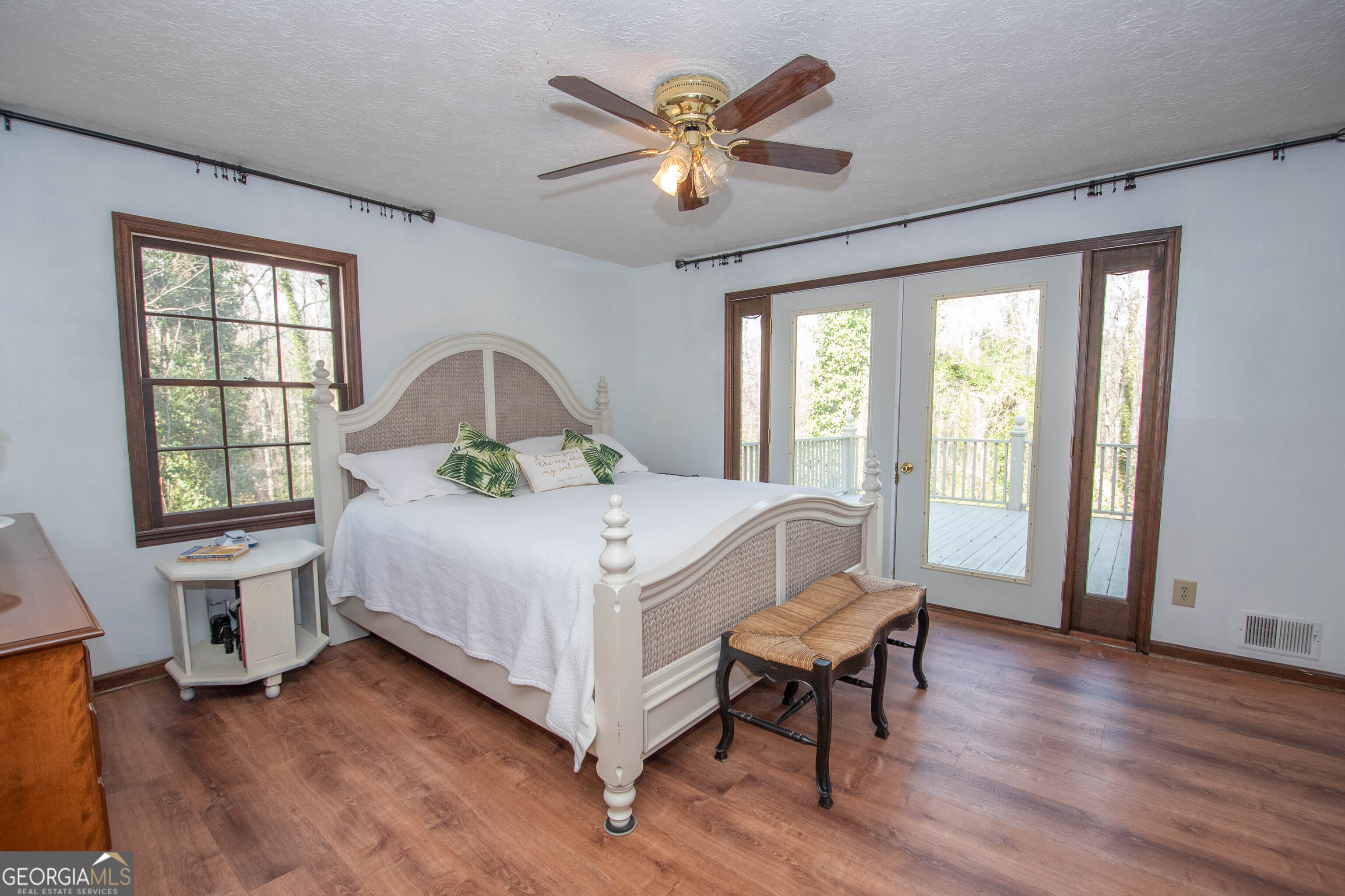 151 Evans Road Milner, GA 30257 - Photo 15 of 53 a bedroom with a bed and a large window