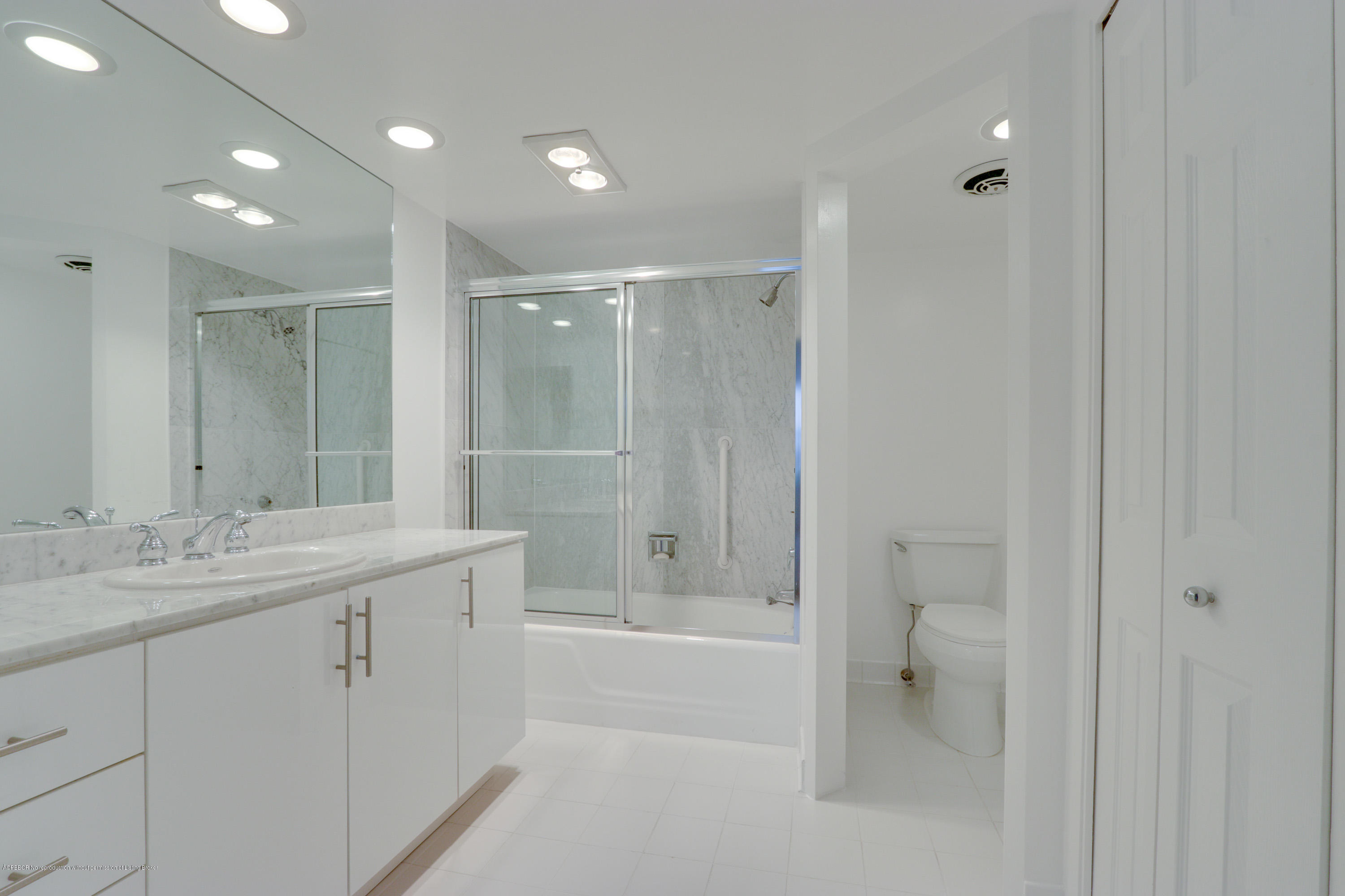 333 Sunset Avenue, Unit 308 Palm Beach, FL 33480 - Photo 15 of 29 a bathroom with a granite countertop sink a toilet and shower