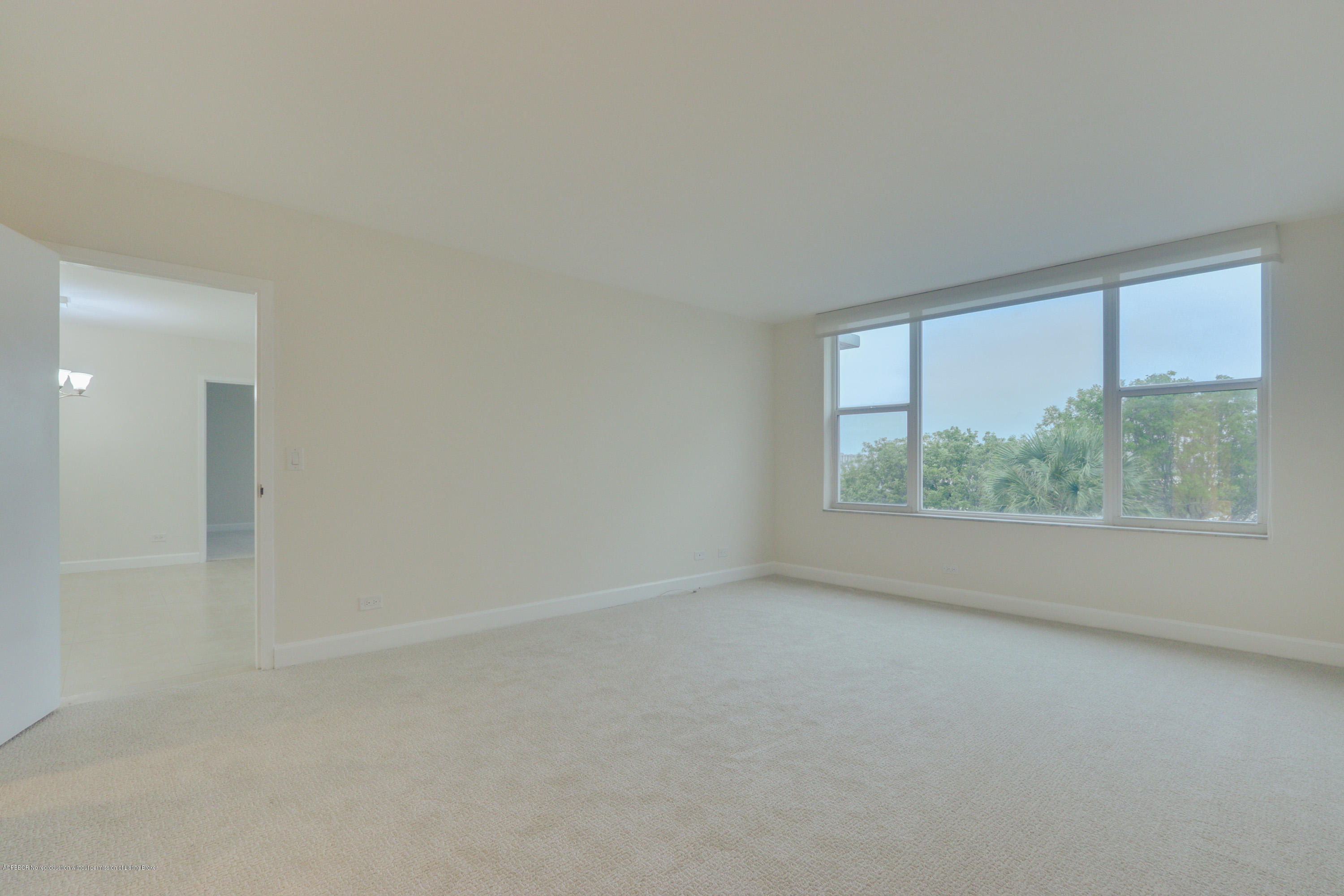 333 Sunset Avenue, Unit 308 Palm Beach, FL 33480 - Photo 16 of 29 an empty room with large windows
