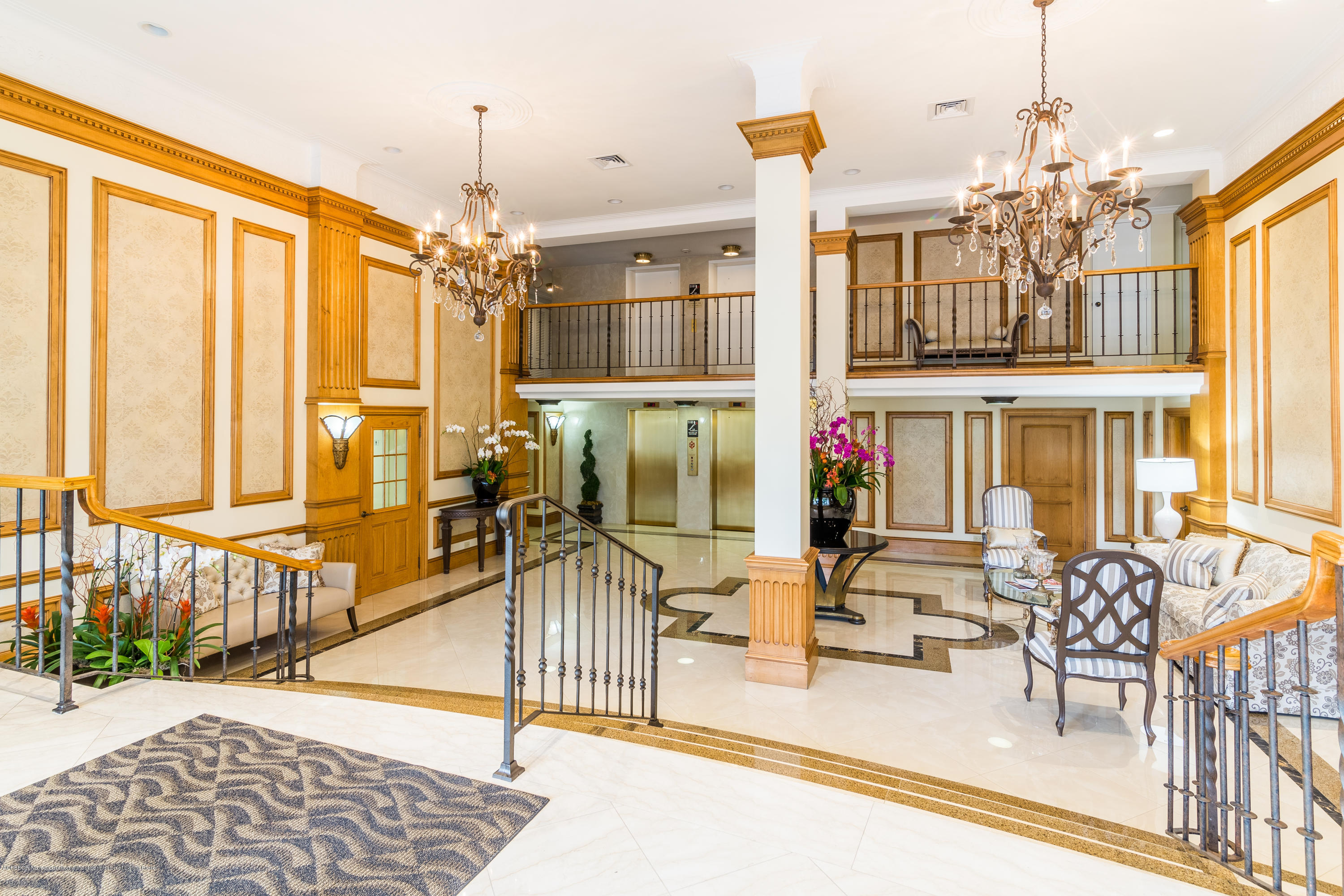 333 Sunset Avenue, Unit 308 Palm Beach, FL 33480 - Photo 6 of 29 a lobby with furniture and floor to ceiling windows