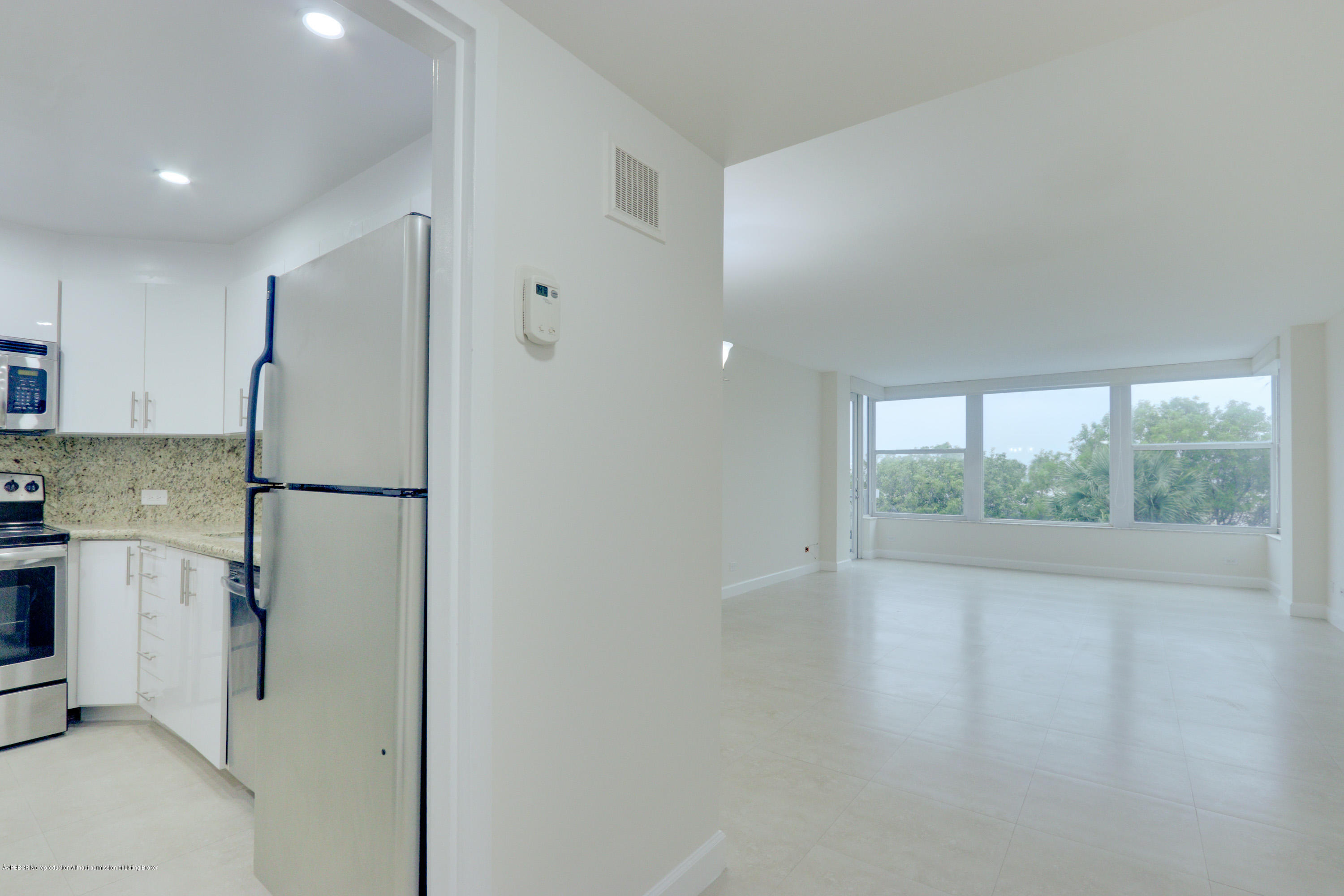 333 Sunset Avenue, Unit 308 Palm Beach, FL 33480 - Photo 7 of 29 a kitchen with a refrigerator and a sink