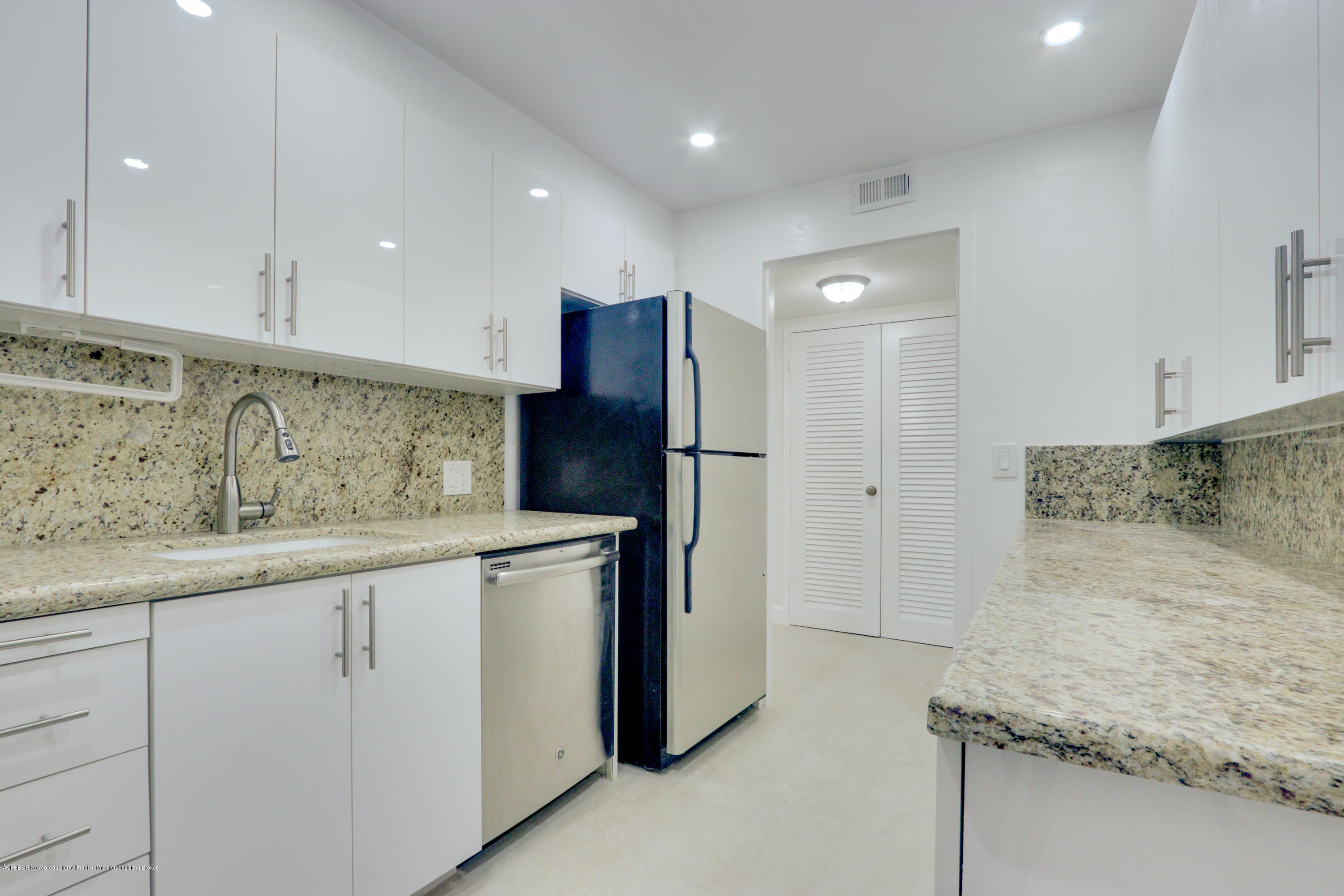 333 Sunset Avenue, Unit 308 Palm Beach, FL 33480 - Photo 10 of 29 a kitchen with a sink and refrigerator