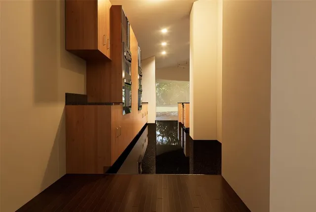 a view of a house with backyard sitting area and garden