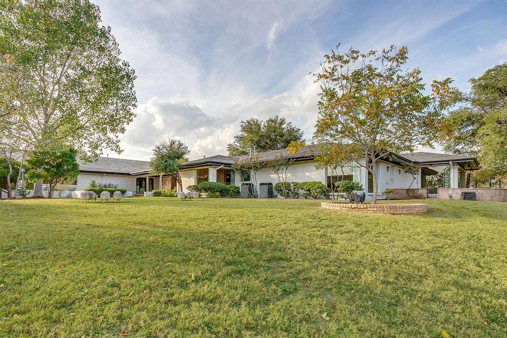 4301 Briarhaven Road Fort Worth, TX 76109 - Photo 15 of 40 a front view of a house with a garden