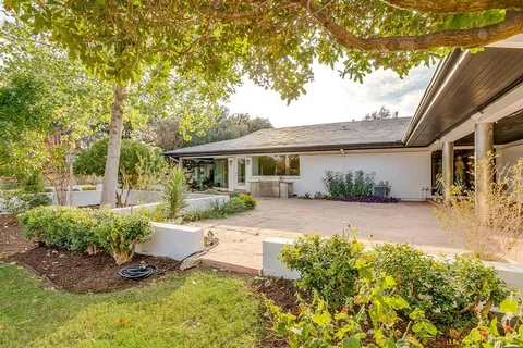 a backyard of a house with lots of green space