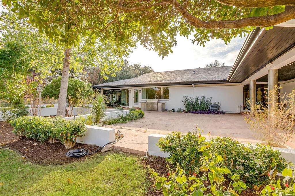 4301 Briarhaven Road Fort Worth, TX 76109 - Photo 17 of 40 a view of a house with backyard sitting area and garden