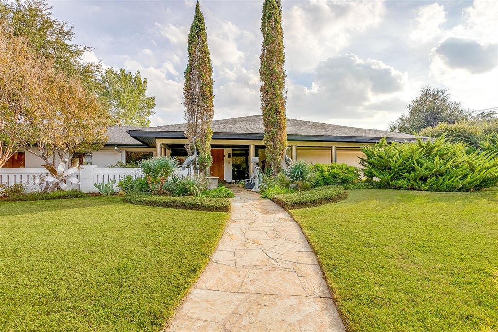 4301 Briarhaven Road Fort Worth, TX 76109 - Photo 6 of 40 a front view of a house with a yard and lake view