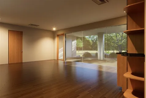 a view of a room with wooden floor and window