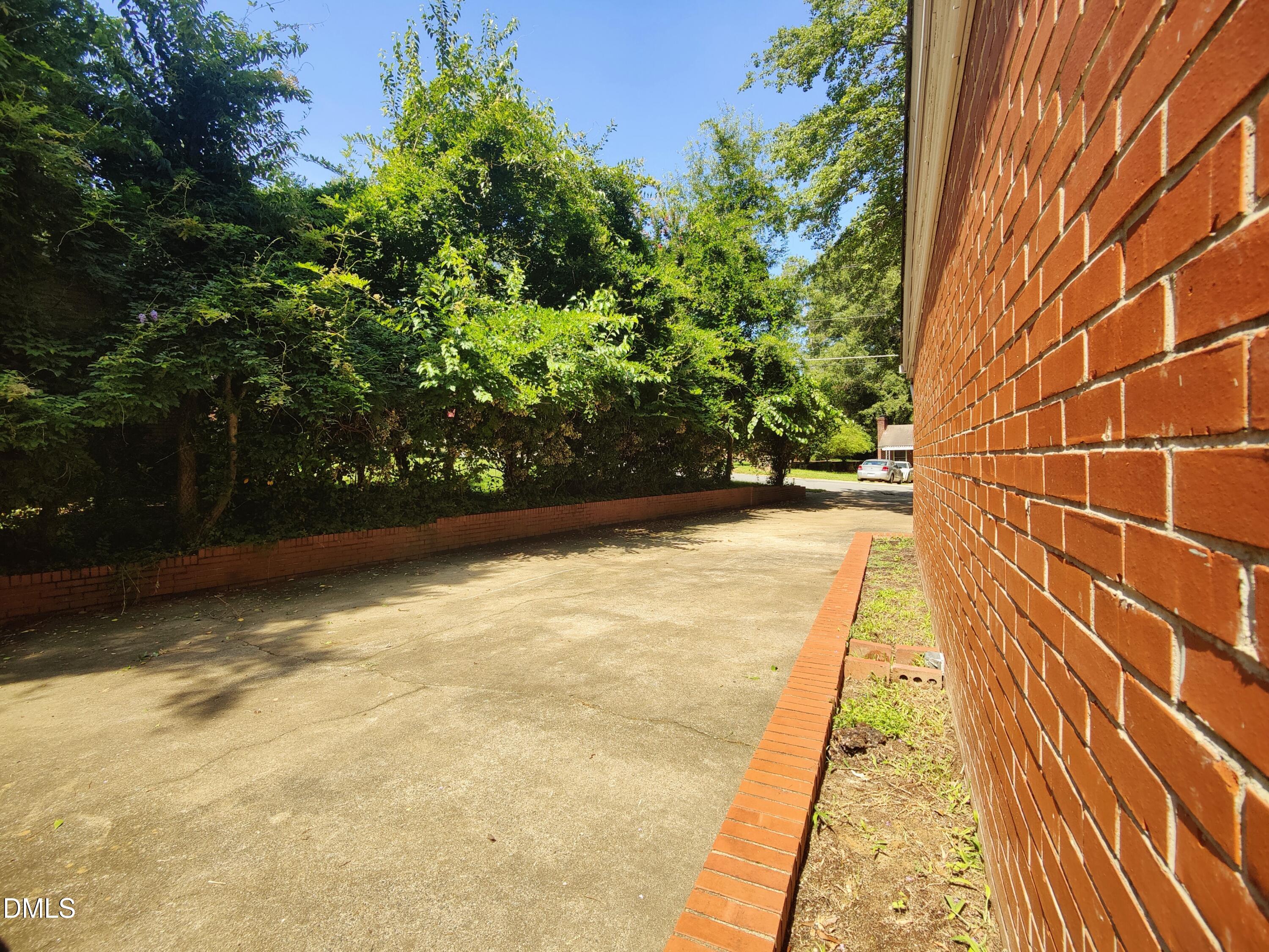 406 Avery Street Garner, NC 27529 - Photo 48 of 55 Large Parking Pad on Right Side of Home