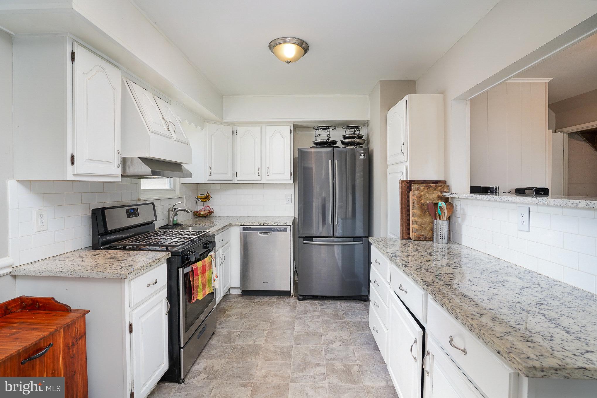 831 Erford Road Camp Hill, PA 17011 - Photo 12 of 36 a kitchen with a refrigerator sink and stove