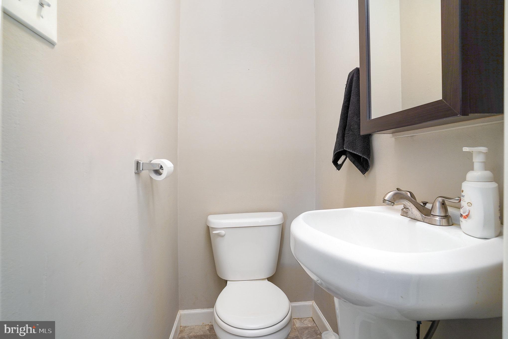 831 Erford Road Camp Hill, PA 17011 - Photo 14 of 36 a bathroom with a toilet sink and mirror