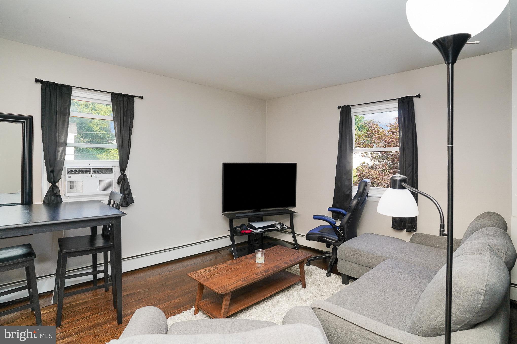 831 Erford Road Camp Hill, PA 17011 - Photo 20 of 36 a living room with furniture and a flat screen tv