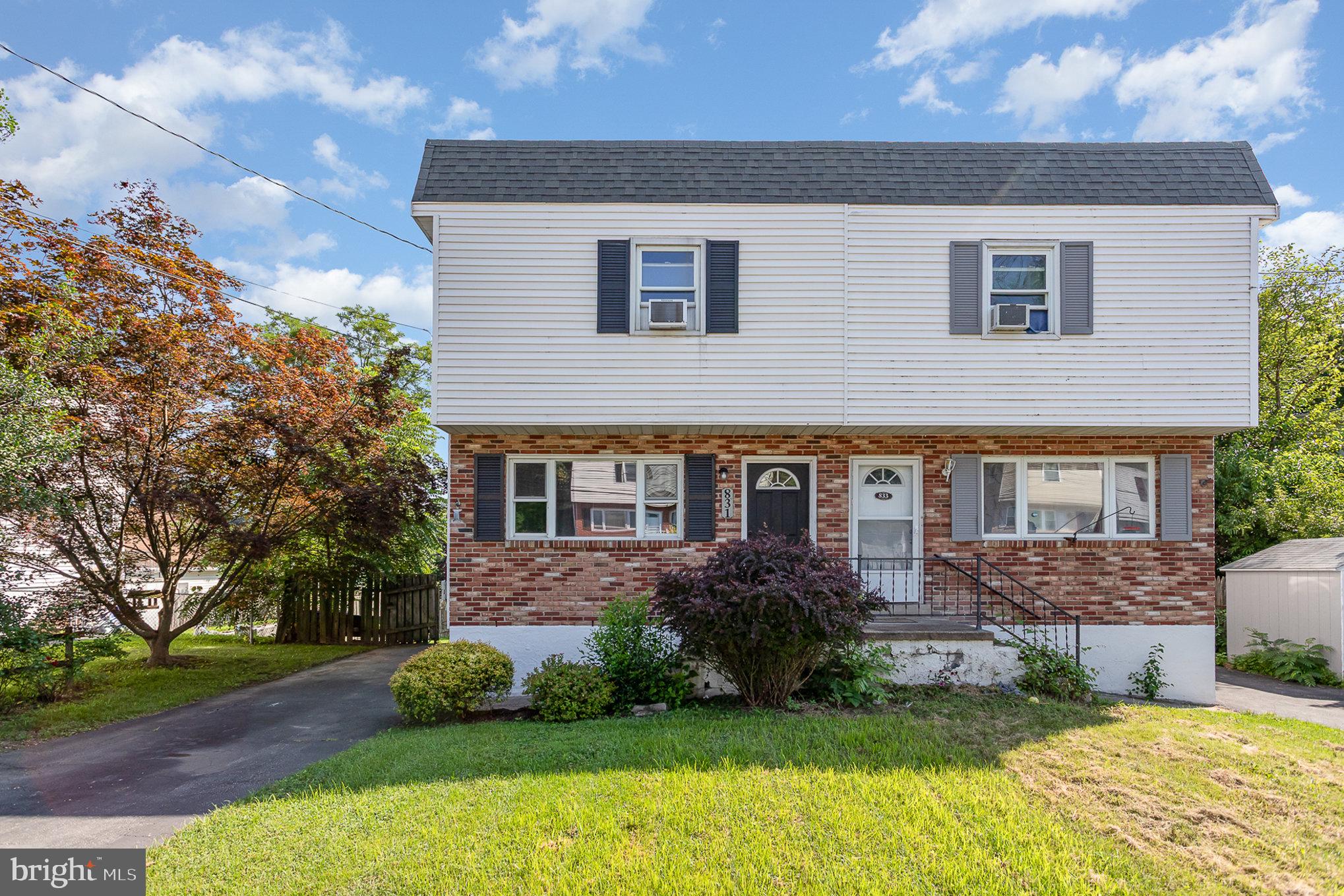 831 Erford Road Camp Hill, PA 17011 - Photo 2 of 36 a front view of a house with garden