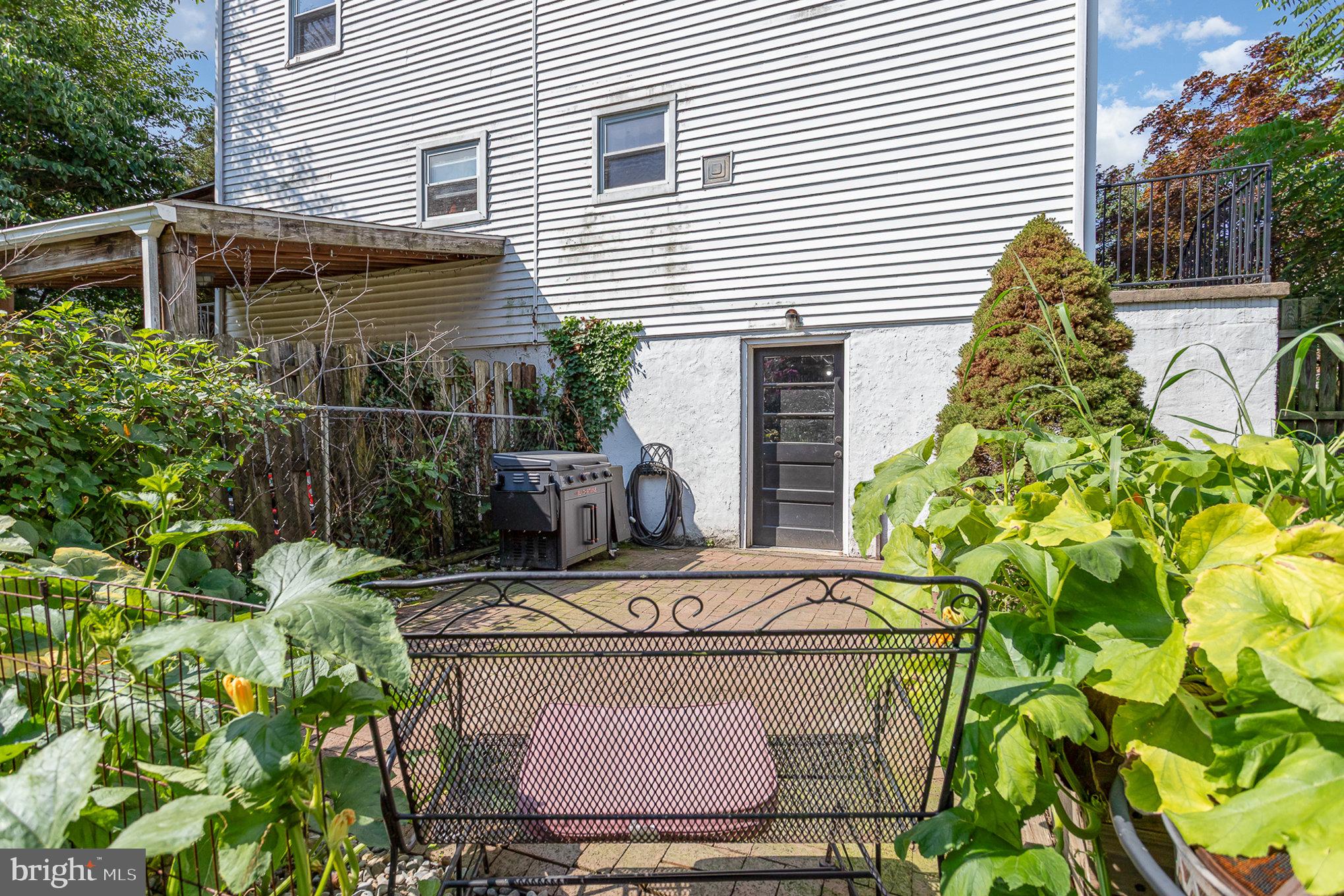 831 Erford Road Camp Hill, PA 17011 - Photo 25 of 36 a white house with a yard and plants
