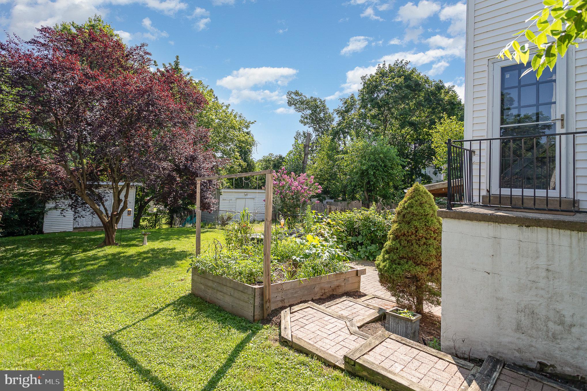 831 Erford Road Camp Hill, PA 17011 - Photo 29 of 36 a view of a backyard with couches plants and large trees