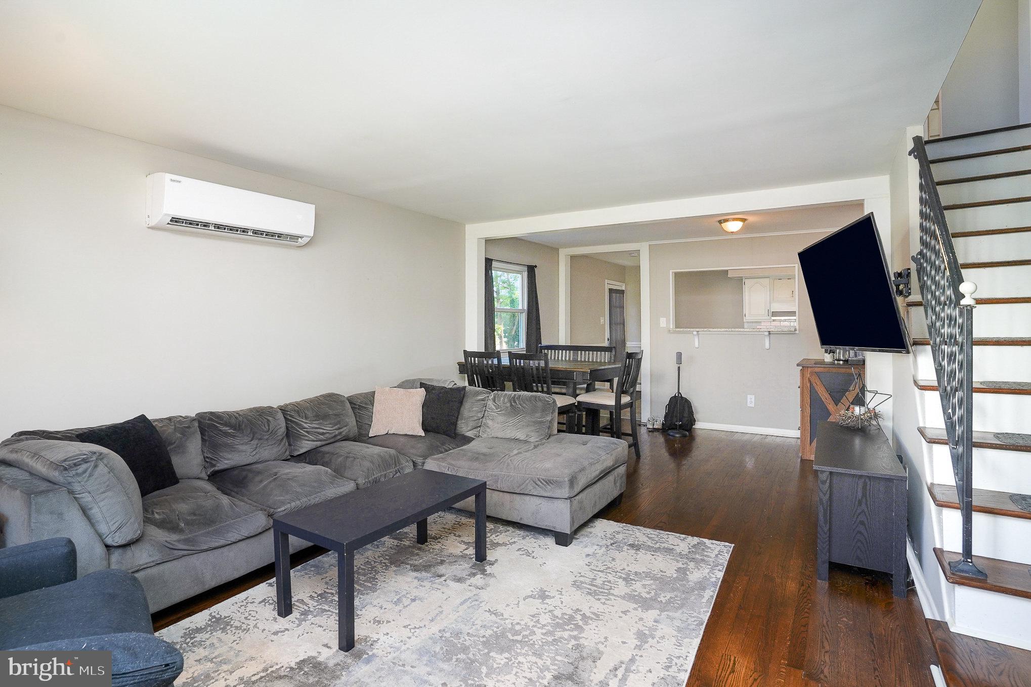 831 Erford Road Camp Hill, PA 17011 - Photo 6 of 36 a living room with furniture a wooden floor and a flat screen tv