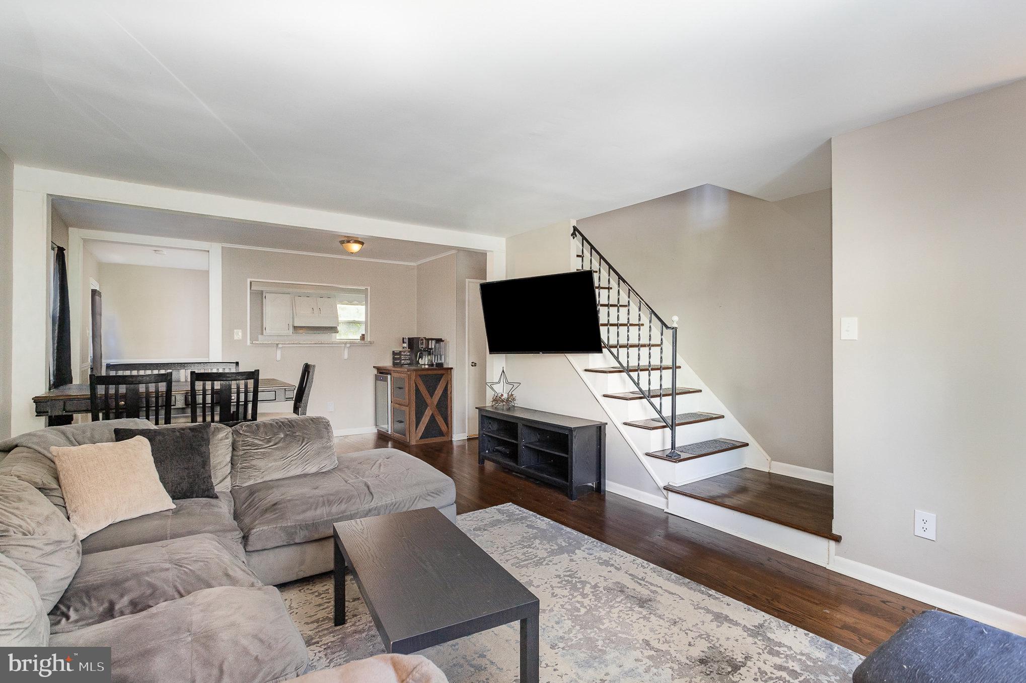 831 Erford Road Camp Hill, PA 17011 - Photo 7 of 36 a living room with furniture and a flat screen tv