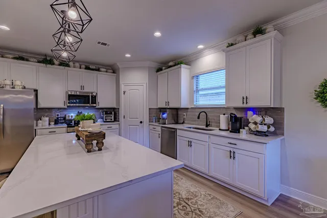 a kitchen with counter space cabinets and appliances