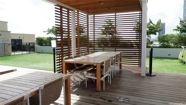 a view of outdoor sitting area with furniture and wooden floor