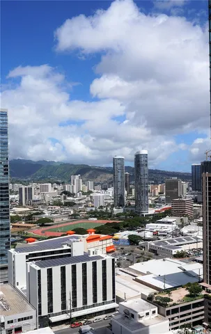 a living room with furniture and large windows
