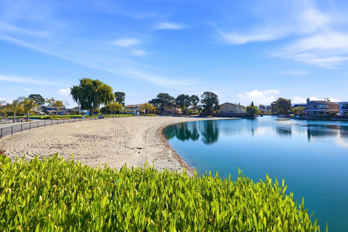 a view of a lake with houses in background