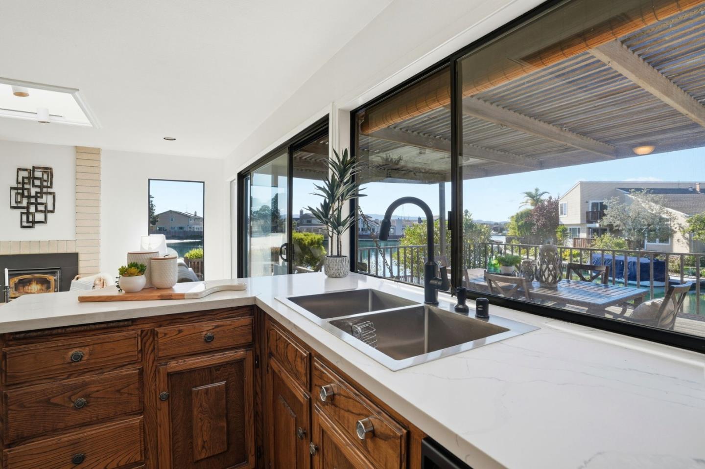 1190 Flying Fish Street Foster City, CA 94404 - Photo 12 of 45 a kitchen with a sink and a large window