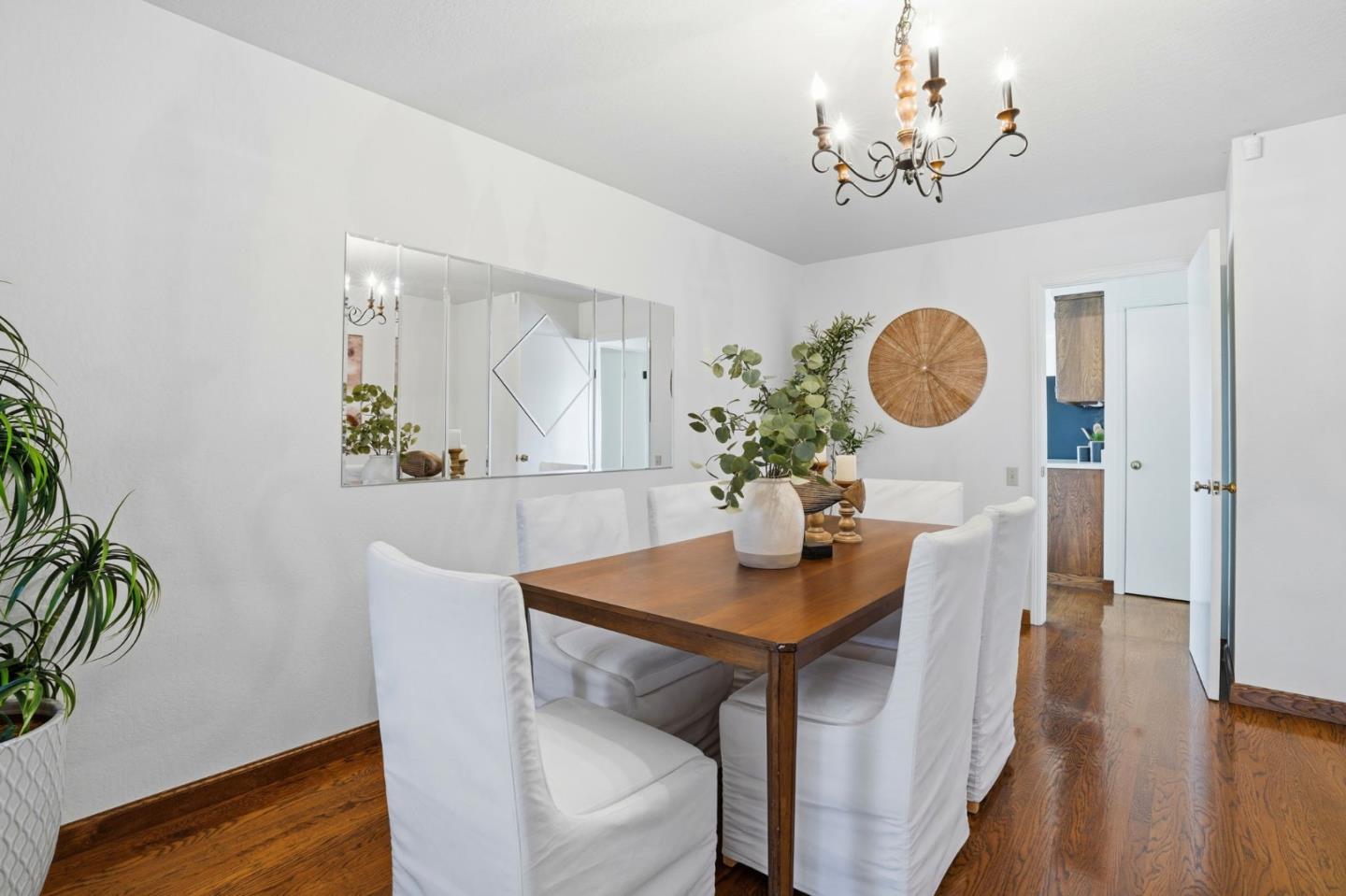 1190 Flying Fish Street Foster City, CA 94404 - Photo 18 of 45 a view of a dining room with furniture and wooden floor
