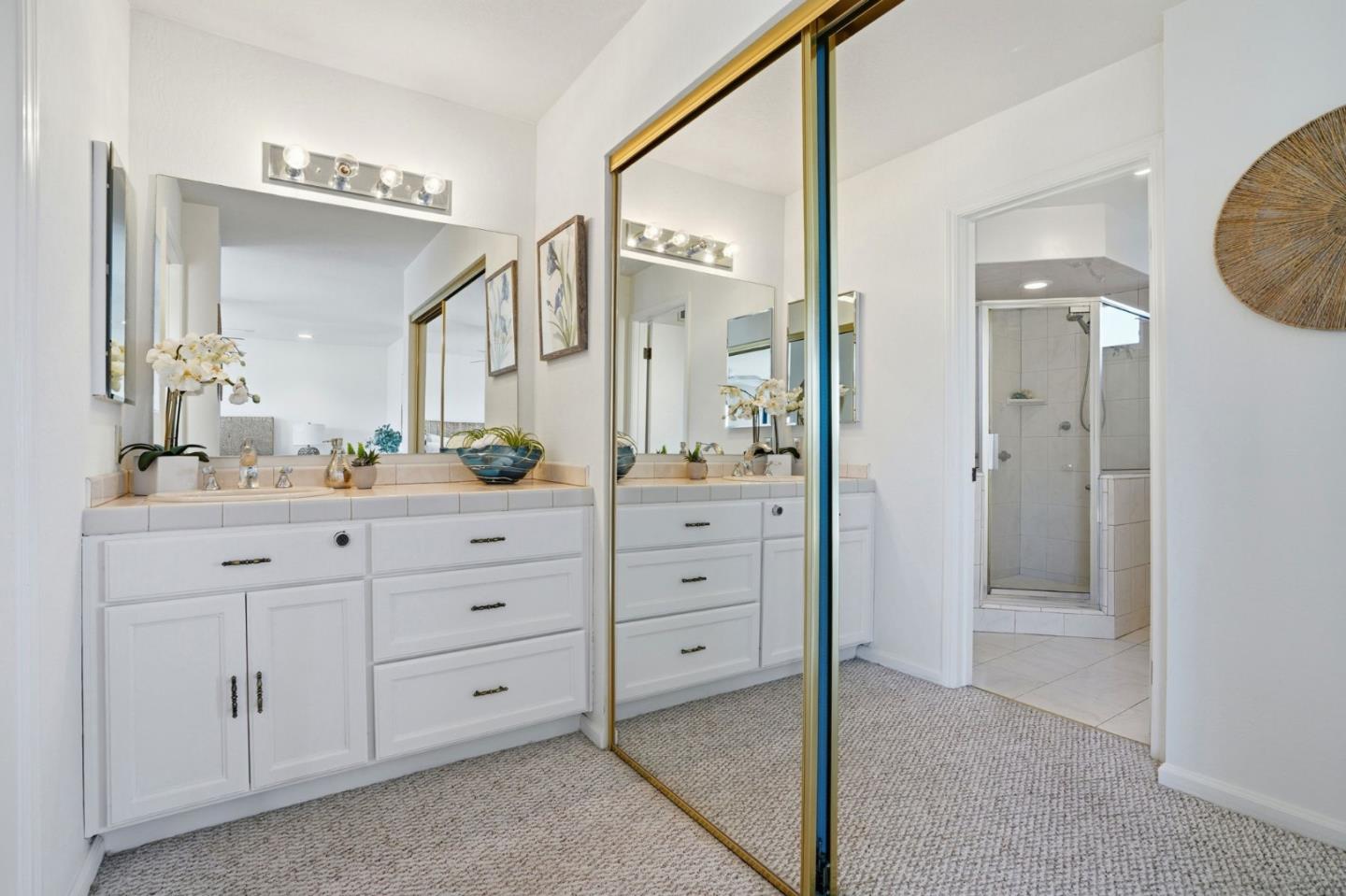 1190 Flying Fish Street Foster City, CA 94404 - Photo 27 of 45 a bathroom with a granite countertop sink mirror and a